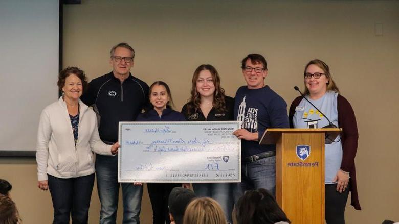 Dance for a Cure presenting check to PSU-LV Benefitting THON's Executive board 