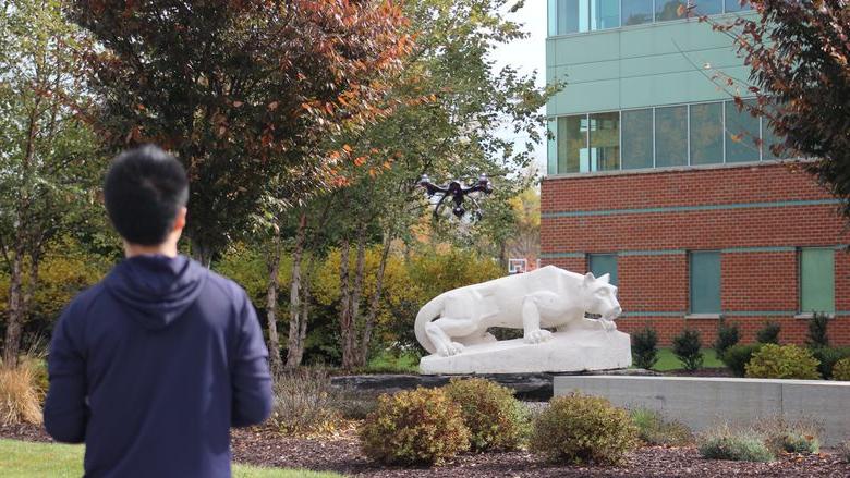 A young man with a drone