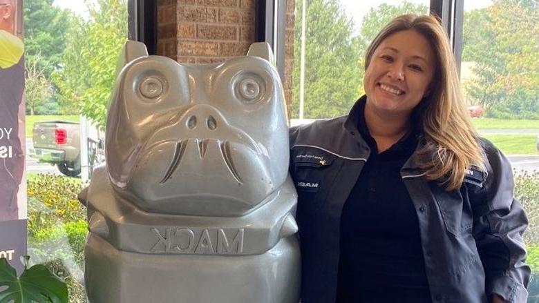 Vernell Daniels stands near bulldog statue