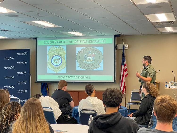 Officers from Delaware Natural Resources Police give presentation to interested CRIMJ students